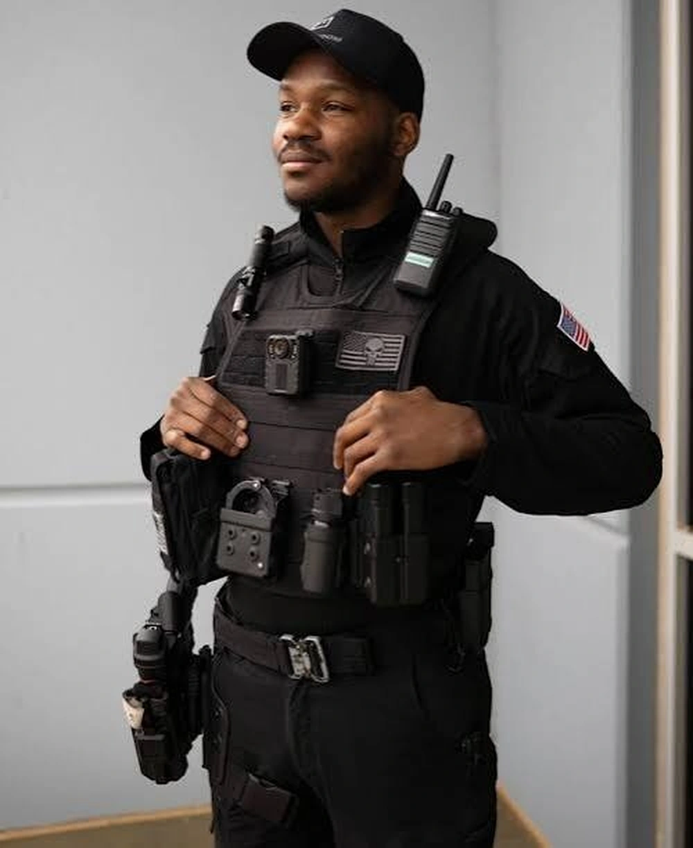 Armed security officer in tactical gear and vest